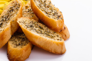 fragrant garlic bread on a white acrylic background