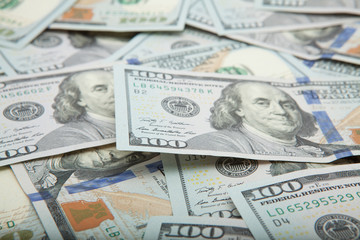 Pile of new design US dollar bills as background. Top view point