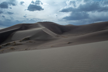 Fototapeta na wymiar Clouds in the sand dunes