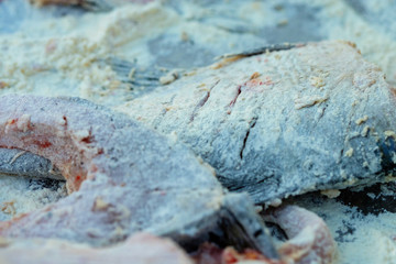 Fry fish on the fire