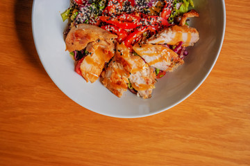 Dinner Dish With Fresh Chicken salad of rucola nuts and green vegetables. Healthy food