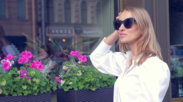 Beautiful woman in sunglasses outdoors