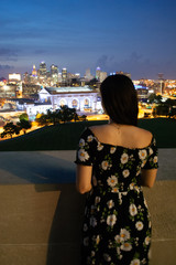 Young woman overlooking city - 228759640
