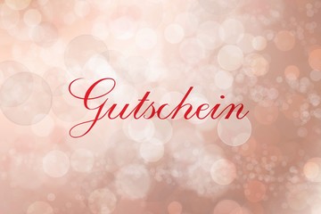 Gutschein auf roten unscharfen Hintergrund