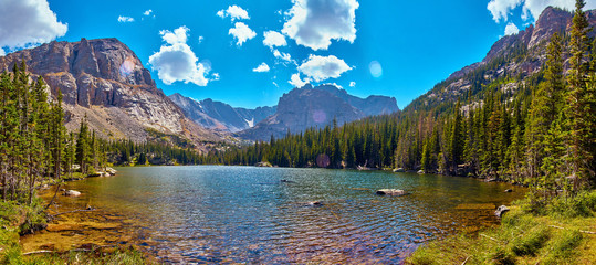 Photographer in Rocky Mountains The Noch lake with mountains panorama - obrazy, fototapety, plakaty