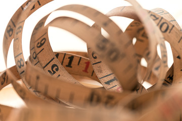 A Vintage measuring tape in loops