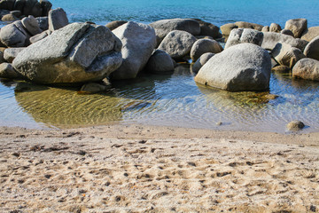 Fototapeta premium Large rock formations on sandy beach , Far East Russia during the day, beautiful rock formations