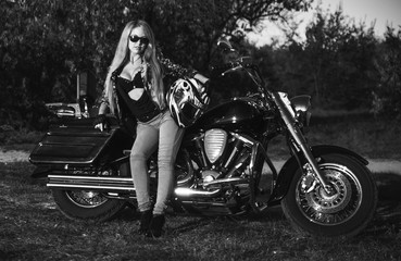 Fototapeta na wymiar Beautiful woman on motorcycle outdoor. 