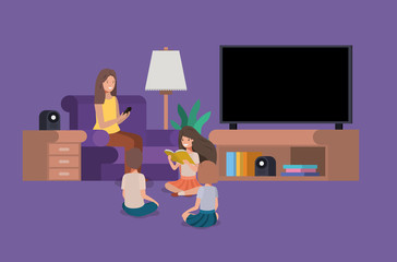 woman with kids in the livingroom reading books