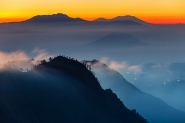 Silhouette Volcanoes mountains in Bromo Tengger Semeru National Park during Sunriset. Java, Indonesia