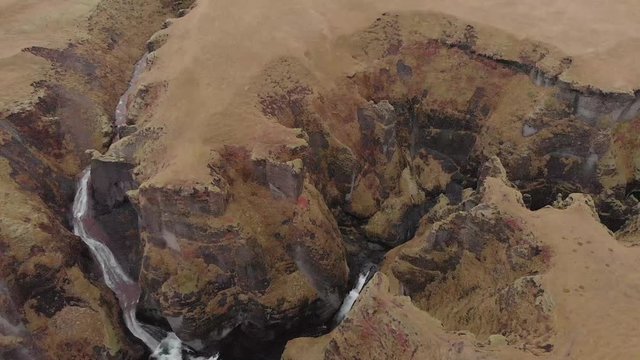 Cinematic aerial flyover of stunning Icelandic canyon.