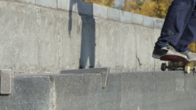 Skatestopper or anti-skate device in work on street granite ledge on monument