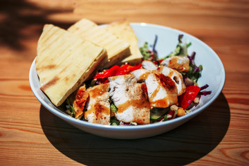 Fryed chicken salad with pita bread