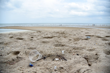 Plastic garbage on the beach. Concept world problems of environmental pollution and ecology. Beach garbage.
