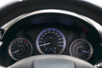  Speed meter is gauge that measurement and display,Closeup dashboard of mileage car with light blue © Amnatdpp