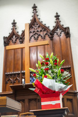 Fototapeta na wymiar Red Rose in Church