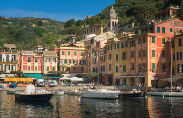 Fototapeta na wymiar Portofino luxury landmark panorama. Village and yacht in little bay harbor. Liguria, Italy