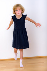 Girl is balancing on one leg