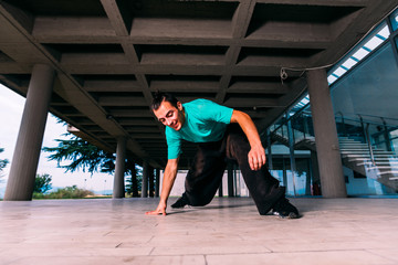 Caucasian man practicing parkour at urban place