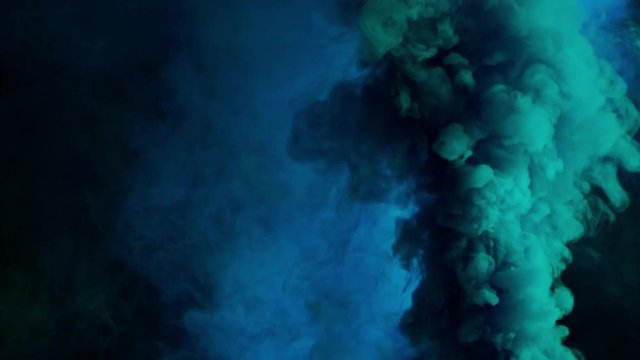 blue and cyan bomb smoke on black background