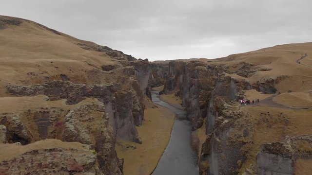 Cinematic aerial flyover of stunning Icelandic canyon.