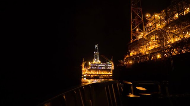 FPSO tanker vessel near Oil platform Rig. Offshore oil and gas industry, sea oil production and storage