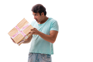 Young handsome man with fragile box ordered from Internet 