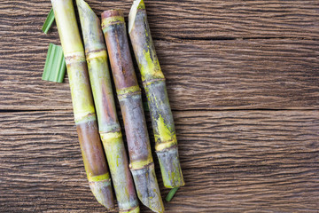 Fototapeta premium Close up sugarcane on wood background close up