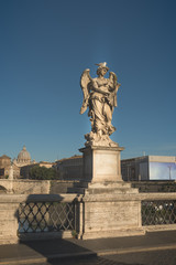 Fototapeta na wymiar View of Vittorio Emanuele bridge on the Tiber river and St. Peter's Basilica in Vatican from saint angel bridge
