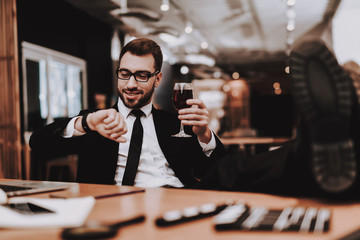 Glass Wine. Wrist Watch. Business Suit. Laptop.