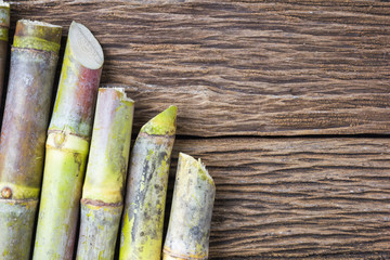 Close up sugarcane on wood background close up