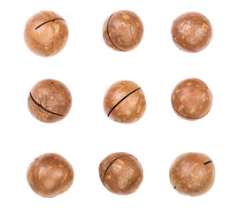 Shelled and unshelled macadamia nuts isolated on white background. Top view. Flat lay pattern. Set or collection