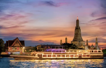 Chao Phraya River Cruise Boat with Temple of the Dawn, Wat Arun, at Sunset in Background, Horizontal © funfunphoto