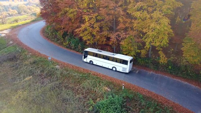Bird's-eye view of a tourist bus on a mountain road