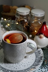 Decorative cookies in the shape of a Christmas tree and snowman and mulled wine with spices
