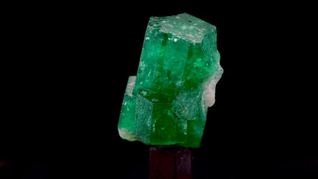 emerald and raw gemstone crystal mineral