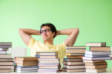 Student with too many books to read before exam