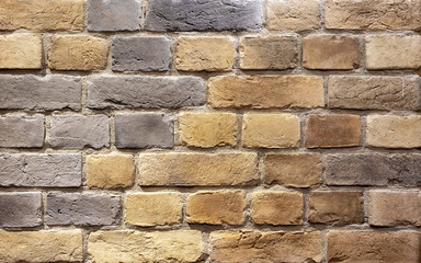 Background of brown building bricks. A wall of bricks.