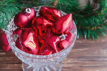 Red Christmas decoration, hearts bells and cones for decorate fir tree. Merry Christmas or New Year...