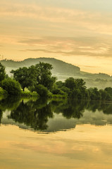 Obraz premium sunset on the river