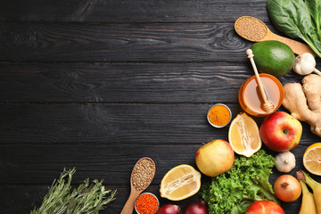 Flat lay composition with natural products and space for text on wooden background. Home remedies for asthma