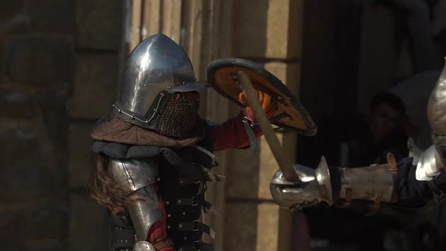 woman knight fighting in battle