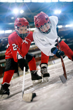 Ice hockey game - action kicking on goal .