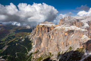 Fototapeta premium view of the mountain Sella Towers from the Terrazza Delle Dolomiti on a sunny day with clouds