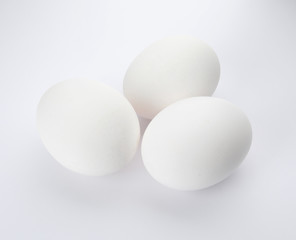 Few raw chicken eggs on white background