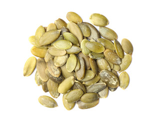 Pile of raw pumpkin seeds on white background, top view