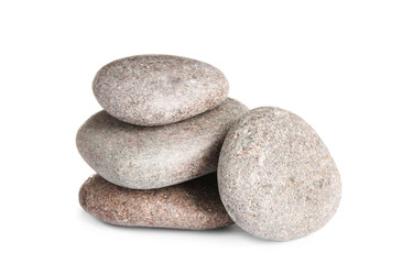 Fototapeta na wymiar Stack of zen spa stones on white background