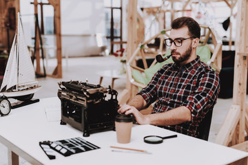 Old Typewriter. Pipe for Smoking. Hands. Ideas.