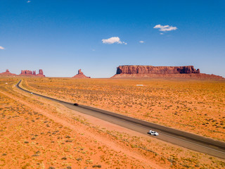 July 30, 2018. Monument Valley National Park, Utah, USA. White Ford Mustang parked by the side of...