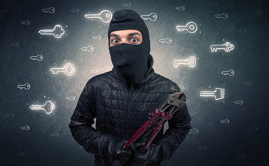 Burglar standing with tools in his hand.